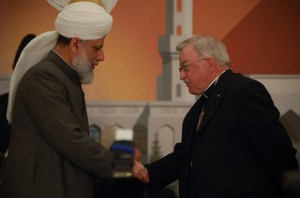 Bishop and Imam shaking hands
