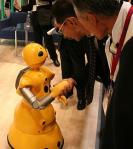 512px-Wakamaru_shaking_hands Companion robot shaking hands with a human