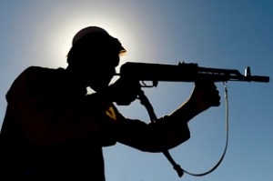silhouette of Afghan fighter with gun
